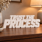 Trust the Process desk letters in Ivory in a home setting