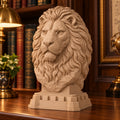 CONQR Regal Lion head desk sculpture on a library desk