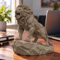 CONQR Roaring Lion desk statue in Sandstorm, tail resting on the rock, on an office desk