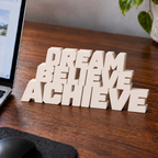 Dream Believe Achieve desk letters in Ivory on an office desk