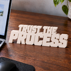Trust the Process desk letters in Ivory on an office desk