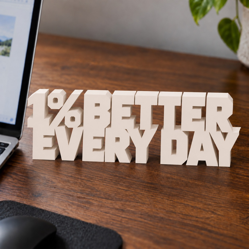 1% Better Every Day desk letters in Ivory on an office desk