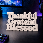 Thankful Grateful Blessed desk letters in Ivory on a gaming desk