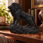 CONQR Roaring Lion desk statue in Black, tail resting on the rock, in a home study
