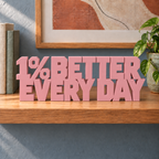 1% Better Every Day desk letters – Sakura Pink on the ledge