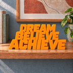 Dream Believe Achieve desk letters – Orange on the ledge
