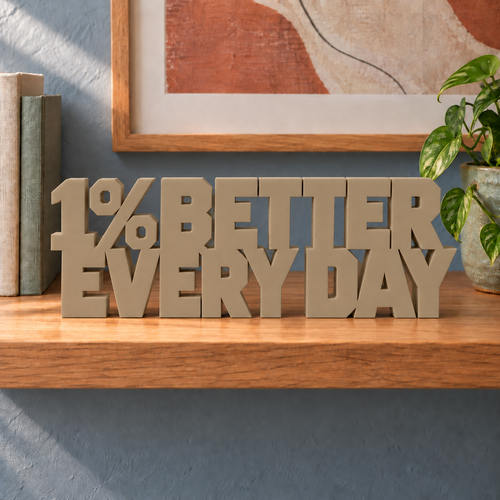 1% Better Every Day desk letters – Sandstorm on the ledge