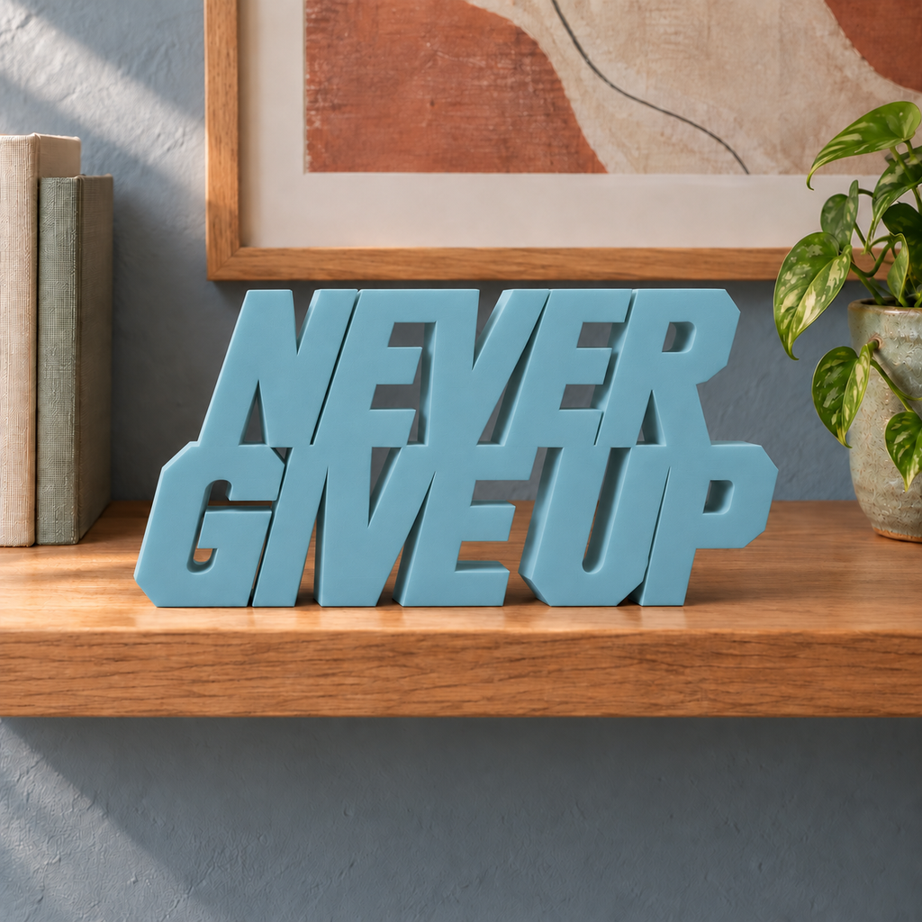 Never Give Up desk letters – Teal Blue on the ledge