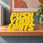 Push Your Limits desk letters – Yellow on the ledge