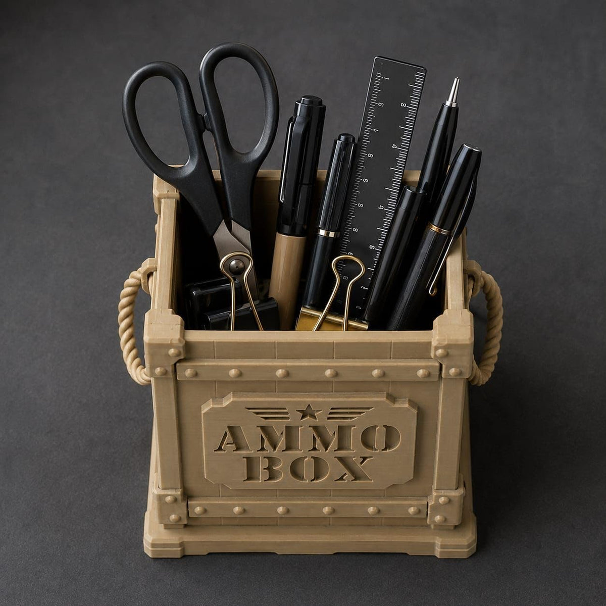 CONQR ammo box pen stand loaded with pens, ruler and scissors, rope handles on both sides
