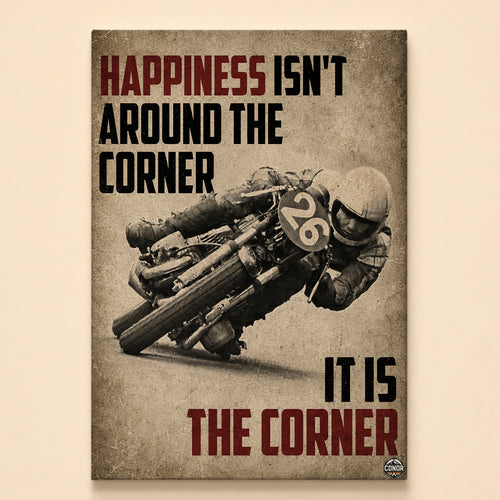 Vintage photograph of a racer leaning a number 26 motorcycle hard into a corner