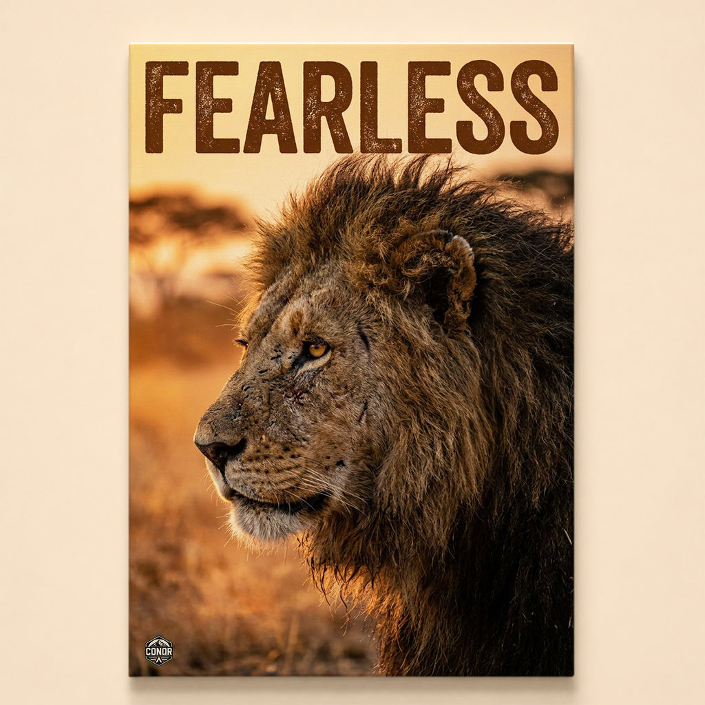 Male lion in side profile on a golden savanna under the word Fearless