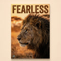 Male lion in side profile on a golden savanna under the word Fearless