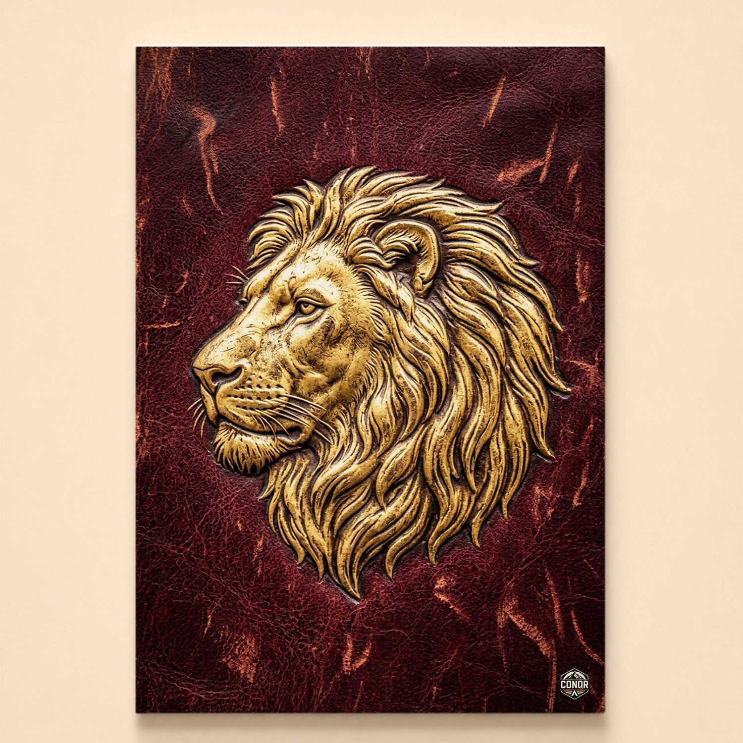 Gold lion head in relief profile on a deep crimson leather texture