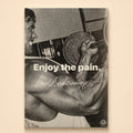 Grainy black-and-white photo of a dumbbell curl – enjoy the pain, signed Arnold Schwarzenegger