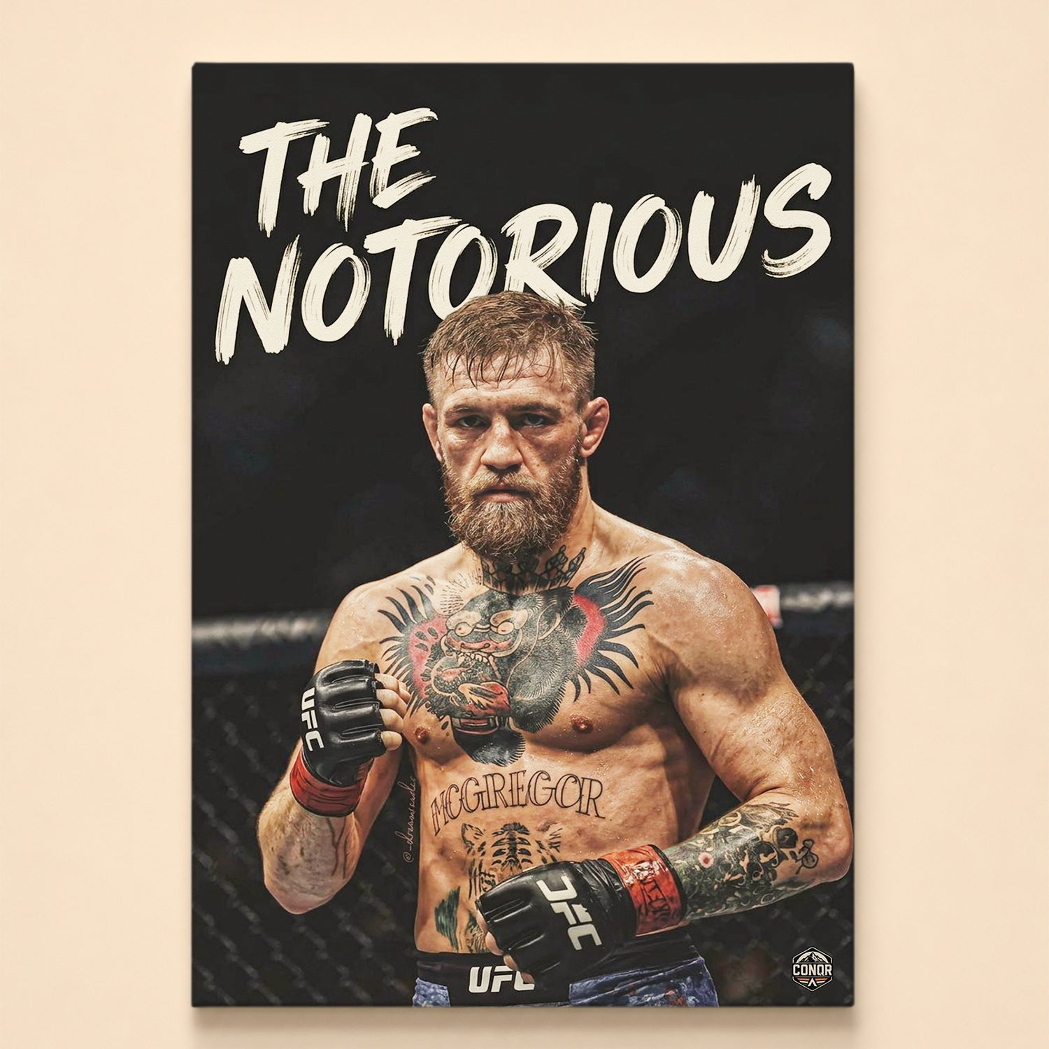 Tattooed MMA fighter in stance under The Notorious brush lettering