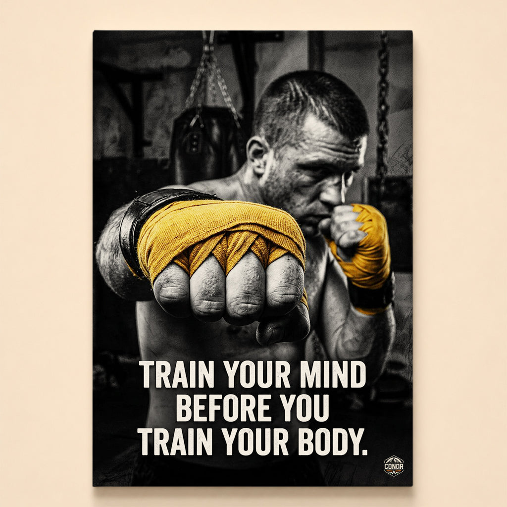 Boxer in fighting stance with gold hand wraps by a punching bag – train your mind before you train your body