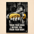Boxer in fighting stance with gold hand wraps by a punching bag – train your mind before you train your body