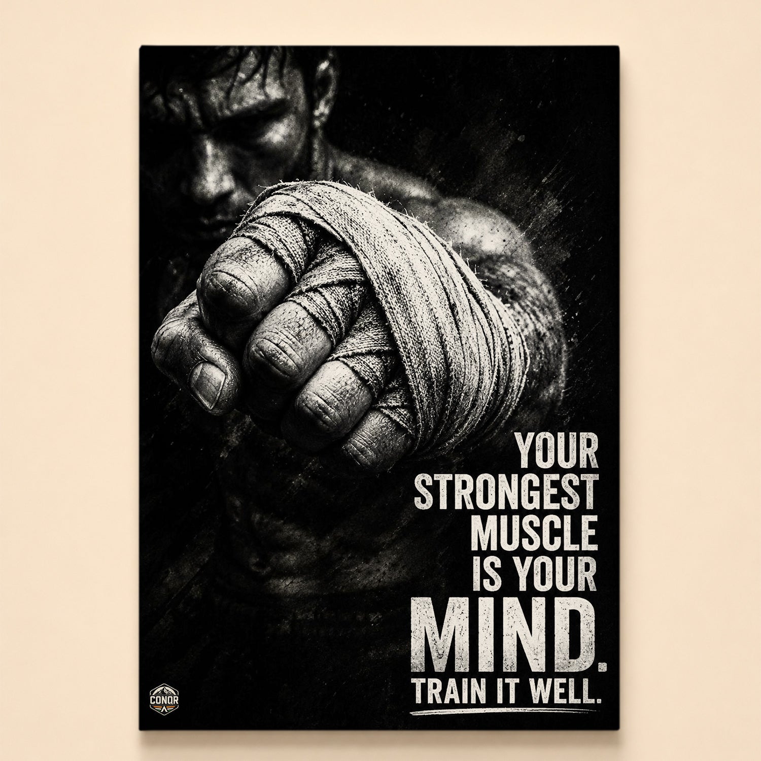 Black-and-white fighter extending a wrapped fist – your strongest muscle is your mind, train it well