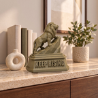 The Lion XL on a marble-topped shelf, shown to scale beside books, a vase and a plant
