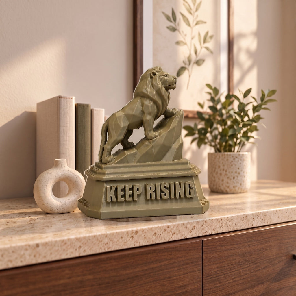 The Lion XXL on a marble-topped shelf, shown to scale beside books, a vase and a plant
