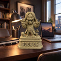 Rock On XL (176 mm) on a dark wooden desk, shown to scale beside a lamp and laptop
