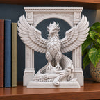 The Phoenix Rise Again desk sculpture in Marble White, large, 20 cm, on a bookshelf