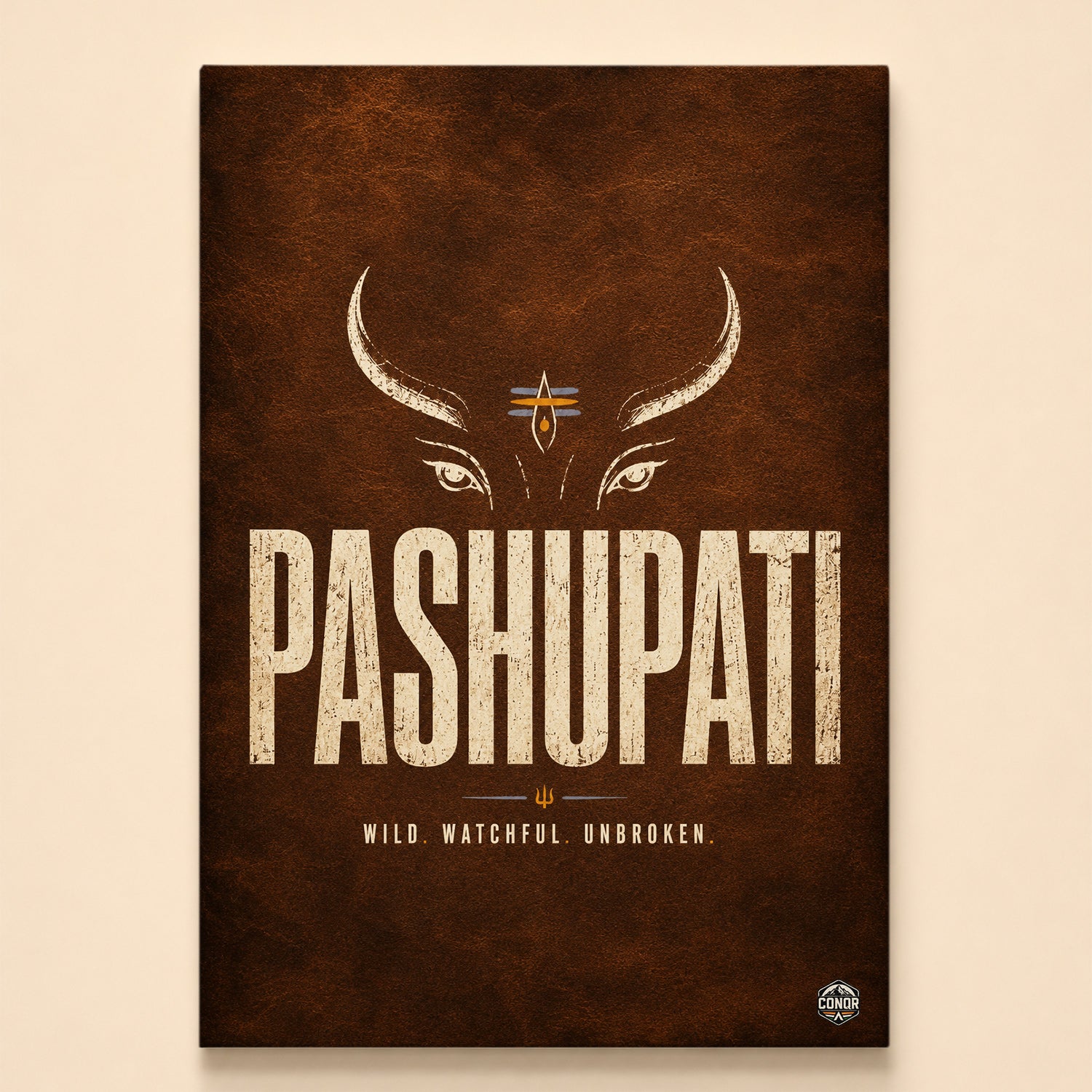 Stylized Pashupati face with bull horns, third eye and trishul on dark leather texture – Wild. Watchful. Unbroken.